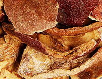 dried yellowish brown herb pieces of Pomegranate Rind