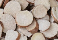 pale whitish herb root slices of White Peony Root are piled together