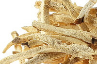 dried pale yellowish herb strips of Seven-lobed Yam Rhizome are piled together