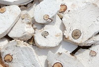 whitish herb slices of Fu-shen with a pine core are piled together